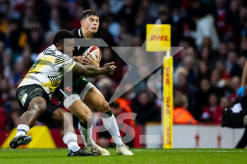2021-11-14 - Louis Rees-Zammit of Wales is tackled by Josua Tuisova of Fiji during the Autumn Nations Series 2021, rugby union test match between Wales and Fiji on November 14, 2021 at Principality Stadium in Cardiff, Wales - TEST MATCH 2021 - WALES VS FIJI - AUTUMN NATIONS SERIES - RUGBY