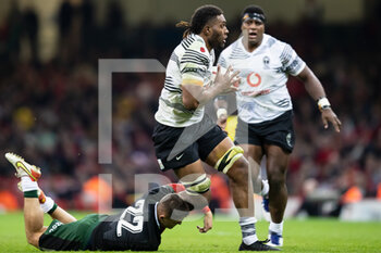 2021-11-14 - Viliame Mata of Fiji is tackled by Callum Sheedy of Wales during the Autumn Nations Series 2021, rugby union test match between Wales and Fiji on November 14, 2021 at Principality Stadium in Cardiff, Wales - TEST MATCH 2021 - WALES VS FIJI - AUTUMN NATIONS SERIES - RUGBY