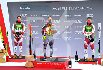 2021-12-29 - Podium winners - 2021 FIS SKI WORLD CUP - MEN'S SUPER GIANT - ALPINE SKIING - WINTER SPORTS