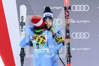 2021-12-12 - 12.12.2021, St. Moritz, St. Moritz, FIS Ski World Cup Women: St. Moritz, Federica Brignone (Italy, right first place) with Elena Curtoni (Italy, left second place) - 2021 FIS SKI WORLD CUP WOMEN - ALPINE SKIING - WINTER SPORTS
