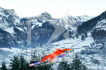 2021-12-18 - December 18, 2021, Engelberg, Gross-Titlis-Schanze, FIS Ski Jumping World Cup Engelberg, Dominik Peter SUI jumps from the hill (in action); Mountain landscape in the background - 2021 FIS SKI JUMPING WORLD CUP - NORDIC SKIING - WINTER SPORTS