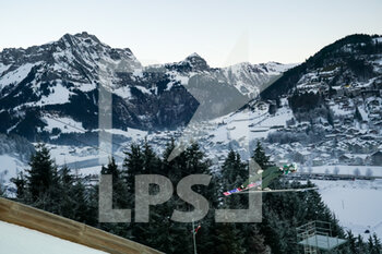 2021-12-18 - December 18, 2021, Engelberg, Gross-Titlis-Schanze, FIS Ski Jumping World Cup Engelberg, jumper jumps from the hill, in action with a mountain view - 2021 FIS SKI JUMPING WORLD CUP - NORDIC SKIING - WINTER SPORTS