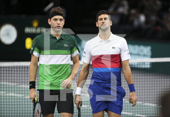 2021-11-01 - Novak Djokovic of Serbia and teammate Filip Krajinovic of Serbia (green shirt) during their double match on day 1 of the Rolex Paris Masters 2021, an ATP Masters 1000 tennis tournament on November 1, 2021 at Accor Arena in Paris, France - ROLEX PARIS MASTERS 2021, AN ATP MASTERS 1000 TENNIS TOURNAMENT - INTERNATIONALS - TENNIS