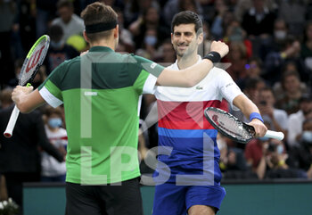 2021-11-01 - Novak Djokovic of Serbia and teammate Filip Krajinovic of Serbia (green shirt) celebrate winning their doubles match on day 1 of the Rolex Paris Masters 2021, an ATP Masters 1000 tennis tournament on November 1, 2021 at Accor Arena in Paris, France - ROLEX PARIS MASTERS 2021, AN ATP MASTERS 1000 TENNIS TOURNAMENT - INTERNATIONALS - TENNIS