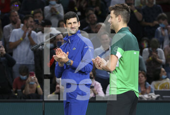 2021-11-01 - Novak Djokovic of Serbia and teammate Filip Krajinovic of Serbia (green shirt) after winning their doubles match on day 1 of the Rolex Paris Masters 2021, an ATP Masters 1000 tennis tournament on November 1, 2021 at Accor Arena in Paris, France - ROLEX PARIS MASTERS 2021, AN ATP MASTERS 1000 TENNIS TOURNAMENT - INTERNATIONALS - TENNIS