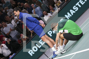 2021-11-01 - Novak Djokovic of Serbia and teammate Filip Krajinovic of Serbia (green shirt) after winning their doubles match on day 1 of the Rolex Paris Masters 2021, an ATP Masters 1000 tennis tournament on November 1, 2021 at Accor Arena in Paris, France - ROLEX PARIS MASTERS 2021, AN ATP MASTERS 1000 TENNIS TOURNAMENT - INTERNATIONALS - TENNIS