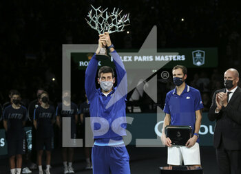 2021-11-07 - Winner Novak Djokovic of Serbia, finalist Daniil Medvedev of Russia during the trophy ceremony of the Rolex Paris Masters 2021 Final, an ATP Masters 1000 tennis tournament on November 7, 2021 at Accor Arena in Paris, France - ROLEX PARIS MASTERS 2021 FINAL, AN ATP MASTERS 1000 TENNIS TOURNAMENT - INTERNATIONALS - TENNIS