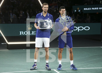 2021-11-07 - Finalist Daniil Medvedev of Russia, winner Novak Djokovic of Serbia during the trophy ceremony of the Rolex Paris Masters 2021 Final, an ATP Masters 1000 tennis tournament on November 7, 2021 at Accor Arena in Paris, France - ROLEX PARIS MASTERS 2021 FINAL, AN ATP MASTERS 1000 TENNIS TOURNAMENT - INTERNATIONALS - TENNIS