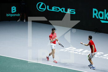 2021-12-01 - Novak Djokovic and Nikola Cacic of Serbia play doubles during the Davis Cup 2021, Quarter Final, tennis match between Serbia and Kazakhstan on December 1, 2021 at Madrid Arena in Madrid, Spain - DAVIS CUP 2021, QUARTER FINAL - SERBIA VS KAZAKHSTAN - INTERNATIONALS - TENNIS