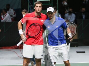 2021-12-03 - Borna Gojo of Croatia and Dusan Lajovic of Serbia during the semi-finals of the Davis Cup 2021, tennis match between Serbia and Croatia on December 3, 2021 at Madrid Arena in Madrid, Spain - SEMIFINALS OF THE DAVIS CUP 2021, SERBIA VS CROATIA - INTERNATIONALS - TENNIS