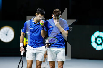 2021-12-03 - Novak Djokovic and Filip Krajinovic of Serbia play doubles during the semi-finals of the Davis Cup 2021, tennis match between Serbia and Croatia on December 3, 2021 at Madrid Arena in Madrid, Spain - SEMIFINALS OF THE DAVIS CUP 2021, SERBIA VS CROATIA - INTERNATIONALS - TENNIS