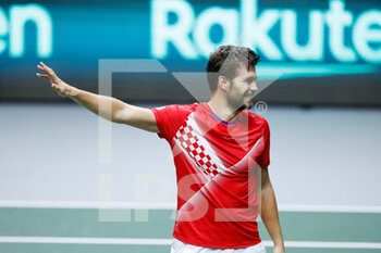 2021-12-03 - Nikola Mektic of Croatia play doubles with Mate Pavic and celebrates the victory during the semi-finals of the Davis Cup 2021, tennis match between Serbia and Croatia on December 3, 2021 at Madrid Arena in Madrid, Spain - SEMIFINALS OF THE DAVIS CUP 2021, SERBIA VS CROATIA - INTERNATIONALS - TENNIS