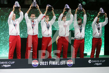 2021-12-05 - Team Croatia celebrate with the the finalist trophy during the final of the Davis Cup 2021, tennis match between Russia and Croatia on December 5, 2021 at Madrid Arena in Madrid, Spain - FINAL OF THE DAVIS CUP 2021 - RUSSIA VS CROATIA - INTERNATIONALS - TENNIS