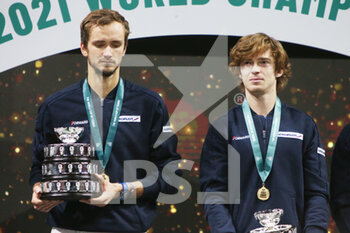 2021-12-05 - Daniil Medvedev and Andrey Rublev of Russia celebrate with the trophy during the final of the Davis Cup 2021, tennis match between Russia and Croatia on December 5, 2021 at Madrid Arena in Madrid, Spain - FINAL OF THE DAVIS CUP 2021 - RUSSIA VS CROATIA - INTERNATIONALS - TENNIS
