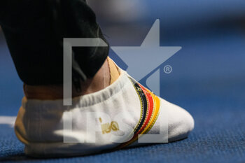 2022-08-13 - 13.8.2022, Munich, Olympiahalle Munich, European Championships Munich 2022: Artistic Gymnastics - Women's Team Final, gymnastic shoes of team Germany with black red gold stripes - EUROPEAN CHAMPIONSHIPS MUNICH 2022: ARTISTIC GYMNASTICS - WOMEN'S TEAM FINAL - GYMNASTICS - OTHER SPORTS