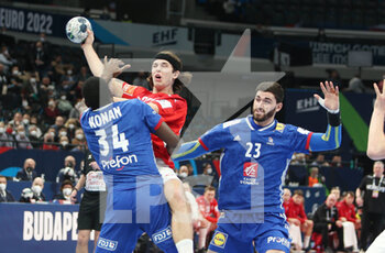 2022-01-30 - Jacob Holm of Denmark and Karl Konan, Ludovic Fabregas of France during the EHF Men's Euro 2022, Placement Match 3/4 handball match between France and Denmark on January 30, 2022 at Budapest Multifunctional Arena in Budapest, Hungary - EHF MEN'S EURO 2022, PLACEMENT MATCH 3/4 - FRANCE VS DENMARK - HANDBALL - OTHER SPORTS