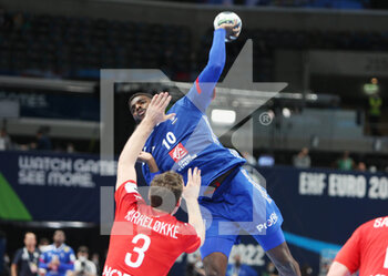 2022-01-30 - Dika Mem of France and Niclas Kirkelokke of Denmark during the EHF Men's Euro 2022, Placement Match 3/4 handball match between France and Denmark on January 30, 2022 at Budapest Multifunctional Arena in Budapest, Hungary - EHF MEN'S EURO 2022, PLACEMENT MATCH 3/4 - FRANCE VS DENMARK - HANDBALL - OTHER SPORTS