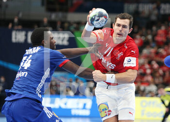 2022-01-30 - Rasmus Lauge of Denmark and Karl Konan of France during the EHF Men's Euro 2022, Placement Match 3/4 handball match between France and Denmark on January 30, 2022 at Budapest Multifunctional Arena in Budapest, Hungary - EHF MEN'S EURO 2022, PLACEMENT MATCH 3/4 - FRANCE VS DENMARK - HANDBALL - OTHER SPORTS