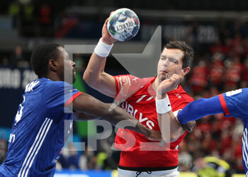 2022-01-30 - Rasmus Lauge of Denmark and Karl Konan of France during the EHF Men's Euro 2022, Placement Match 3/4 handball match between France and Denmark on January 30, 2022 at Budapest Multifunctional Arena in Budapest, Hungary - EHF MEN'S EURO 2022, PLACEMENT MATCH 3/4 - FRANCE VS DENMARK - HANDBALL - OTHER SPORTS