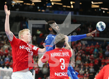 2022-01-30 - Dika Mem of France and Magnus Saugstrup, Niclas Kirkelokke of Denmark during the EHF Men's Euro 2022, Placement Match 3/4 handball match between France and Denmark on January 30, 2022 at Budapest Multifunctional Arena in Budapest, Hungary - EHF MEN'S EURO 2022, PLACEMENT MATCH 3/4 - FRANCE VS DENMARK - HANDBALL - OTHER SPORTS