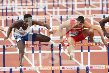2022-08-17 - Just Kwaou-Mathey of France and Asier Martinez of Spain during the Athletics, Semi-final Men's 110m Hurdles at the European Championships Munich 2022 on August 17, 2022 in Munich, Germany - EUROPEAN CHAMPIONSHIPS MUNICH 2022 - INTERNATIONALS - ATHLETICS