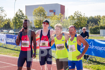 02/10/2022 - Niccolò Pirosu and Matteo Tassetti with the guides after T12 200m sprint - ITALIAN PARATHLETICS CHAMPIONSHIPS - NATIONAL FINALS - NAZIONALI - ATLETICA