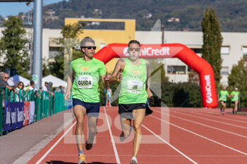 02/10/2022 - Davide Foglio and his guide during 200m T12 sprint - ITALIAN PARATHLETICS CHAMPIONSHIPS - NATIONAL FINALS - NAZIONALI - ATLETICA