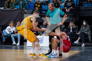 07/12/2022 - #3 PETROPOULOS ANDREAS of AEK Athens BC helping #20 ANDREA CINCIARINI of UNAHOTELS Reggio Emilia during the Basketball Champions League, Gameday 5, match between AEK Athens BC and UNAHOTELS Reggio Emilia at Ano Liossia Olympic Hall on December 7, 2022 in Athens, Greece. - AEK ATHENS VS UNAHOTELS REGGIO EMILIA - CHAMPIONS LEAGUE - BASKET