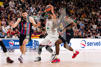 2022-10-28 - Brandon Davies of EA7 Emporio Armani Milan in action against Nicola Kalinic and James Nnaji of FC Barcelona during the Turkish Airlines EuroLeague basketball match between FC Barcelona and EA7 Emporio Armani Milan on October 28, 2022 at Palau Blaugrana in Barcelona, Spain - BASKETBALL - EUROLEAGUE - FC BARCELONA V MILAN - EUROLEAGUE - BASKETBALL
