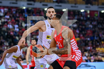 2022-11-10 - #21 JOEL BOLOMBOY of Olympiacos Piraeus competing with #10 IOANNIS PAPAPETROU of Partizan during the Euroleague, Round 7, match between Olympiacos Piraeus and Partizan at Peace And Friendship Stadium on November 10, 2022 in Athens, Greece. - OLYMPIACOS BC VS PARTIZAN - EUROLEAGUE - BASKETBALL
