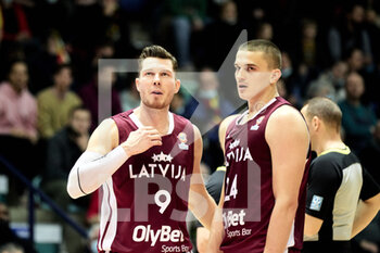 2022-02-25 - Dairis BERTANS (9) of Latvia and Andrejs GRAZULIS (24) of Latvia during the FIBA World Cup 2023, European qualifiers, 1st round Group A Basketball match between Belgium and Latvia on February 25, 2022 at the Mons Arena in Mons, Belgium - FIBA WORLD CUP 2023, EUROPEAN QUALIFIERS, 1ST ROUND GROUP A - BELGIUM VS LATVIA - INTERNATIONALS - BASKETBALL