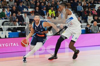 2022-12-04 - Jordan Howard (GeVi Napoli Basket) thwarted by Kenny Gabriel (Pallacanestro Germani Brescia)  - GERMANI BRESCIA VS GEVI NAPOLI BASKET - ITALIAN SERIE A - BASKETBALL