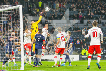 2022-03-24 - Lukasz Skorupski of Poland punches the ball away during the International Friendly football match between Scotland and Poland on March 24, 2022 at Hampden Park in Glasgow, Scotland - SCOTLAND VS POLAND - FRIENDLY MATCH - SOCCER