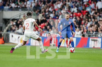 2022-03-26 - LONDON, ENGLAND - MARCH 26: during the international friendly match between England and Switzerland at Wembley Stadium on March 26, 2022 in London, United Kingdom. Luke Shaw of England against Kevin Mbabu of Switzerland - ENGLAND VS SWITZERLAND - FRIENDLY MATCH - SOCCER