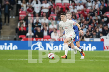 2022-03-26 - LONDON, ENGLAND - MARCH 26: during the international friendly match between England and Switzerland at Wembley Stadium on March 26, 2022 in London, United Kingdom. Granit Xhaka of Switzerland against Jordan Henderson of England - ENGLAND VS SWITZERLAND - FRIENDLY MATCH - SOCCER