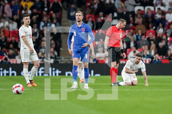 2022-03-26 - LONDON, ENGLAND - MARCH 26: during the international friendly match between England and Switzerland at Wembley Stadium on March 26, 2022 in London, United Kingdom. Left to right: Granit Xhaka of Switzerland, Jordan Henderson of England, referee Andreas Ekberg and Xherdan Shaqiri of Switzerland - ENGLAND VS SWITZERLAND - FRIENDLY MATCH - SOCCER