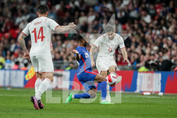 2022-03-26 - LONDON, ENGLAND - MARCH 26: during the international friendly match between England and Switzerland at Wembley Stadium on March 26, 2022 in London, United Kingdom. Ricardo Rodriguez of Switzerland against Raheem Sterling of England - ENGLAND VS SWITZERLAND - FRIENDLY MATCH - SOCCER