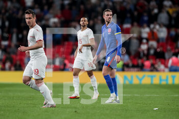 2022-03-26 - LONDON, ENGLAND - MARCH 26: during the international friendly match between England and Switzerland at Wembley Stadium on March 26, 2022 in London, United Kingdom. Left to right: <s19, Djibril Sow of Switzerland and Jordan Henderson of England - ENGLAND VS SWITZERLAND - FRIENDLY MATCH - SOCCER