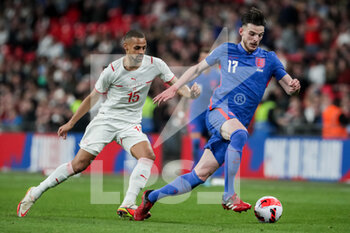2022-03-26 - LONDON, ENGLAND - MARCH 26: during the international friendly match between England and Switzerland at Wembley Stadium on March 26, 2022 in London, United Kingdom. Declan Rice of England against Djibril Sow of Switzerland - ENGLAND VS SWITZERLAND - FRIENDLY MATCH - SOCCER