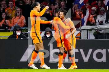 2022-03-26 - Nathan Ake of the Netherlands celebrates with Virgil van Dijk and Denzel Dumfries after scoring his sides second goal during the International Friendly football match between Netherlands and Denmark on March 26, 2022 at the Johan Cruijff ArenA in Amsterdam, Netherlands - NETHERLANDS VS DENMARK - FRIENDLY MATCH - SOCCER