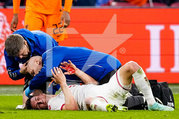 2022-03-26 - Joakim Maehle of Denmark receives medical treatment during the International Friendly football match between Netherlands and Denmark on March 26, 2022 at the Johan Cruijff ArenA in Amsterdam, Netherlands - NETHERLANDS VS DENMARK - FRIENDLY MATCH - SOCCER
