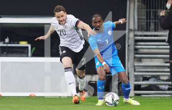 2022-03-26 - Christian Gunter of Germany and Eli Dasa of Israel during the International Friendly football match between Germany and Israel on March 26, 2022 at PreZero Arena in Sinsheim, Germany - GERMANY VS ISRAEL - FRIENDLY MATCH - SOCCER