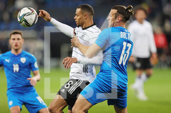 2022-03-26 - Lukas Nmecha of Germany and Sean Goldberg of Israel during the International Friendly football match between Germany and Israel on March 26, 2022 at PreZero Arena in Sinsheim, Germany - GERMANY VS ISRAEL - FRIENDLY MATCH - SOCCER