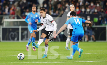 2022-03-26 - Jamal Musiala of Germany and Yonatan Cohen of Israel during the International Friendly football match between Germany and Israel on March 26, 2022 at PreZero Arena in Sinsheim, Germany - GERMANY VS ISRAEL - FRIENDLY MATCH - SOCCER
