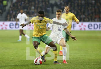 2022-03-29 - Teboho Mokoena of South Africa, Lucas Digne of France during the International Friendly football match between France and South Africa on March 29, 2022 at Stade Pierre Mauroy in Villeneuve-d'Ascq near Lille, France - FRANCE VS SOUTH AFRICA - FRIENDLY MATCH - SOCCER