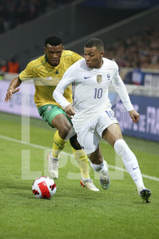 2022-03-29 - Kylian Mbappe of France, Mothobi Mvala of South Africa (left) during the International Friendly football match between France and South Africa on March 29, 2022 at Stade Pierre Mauroy in Villeneuve-d'Ascq near Lille, France - FRANCE VS SOUTH AFRICA - FRIENDLY MATCH - SOCCER