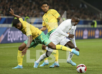 2022-03-29 - Moussa Diaby of France, left Lyle Lakay, Keagan Dolly of South Africa during the International Friendly football match between France and South Africa on March 29, 2022 at Stade Pierre Mauroy in Villeneuve-d'Ascq near Lille, France - FRANCE VS SOUTH AFRICA - FRIENDLY MATCH - SOCCER