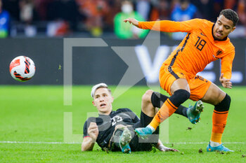 2022-03-29 - Nico Schlotterbeck of Germany, Donyell Malen of the Netherlands during the International Friendly football match between Netherlands and Germany on March 29, 2022 at the Johan Cruijff ArenA in Amsterdam, Netherlands - NETHERLANDS VS GERMANY - FRIENDLY MATCH - SOCCER
