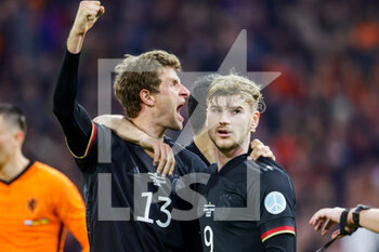 2022-03-29 - Thomas Muller of Germany is celebrating his goal with Timo Werner during the International Friendly football match between Netherlands and Germany on March 29, 2022 at the Johan Cruijff ArenA in Amsterdam, Netherlands - NETHERLANDS VS GERMANY - FRIENDLY MATCH - SOCCER