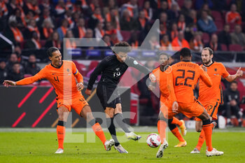 2022-03-29 - Leroy Sane of Germany battles for the ball with Virgil van Dijk of the Netherlands and Denzel Dumfries of the Netherlands during the International Friendly football match between Netherlands and Germany on March 29, 2022 at the Johan Cruijff ArenA in Amsterdam, Netherlands - NETHERLANDS VS GERMANY - FRIENDLY MATCH - SOCCER